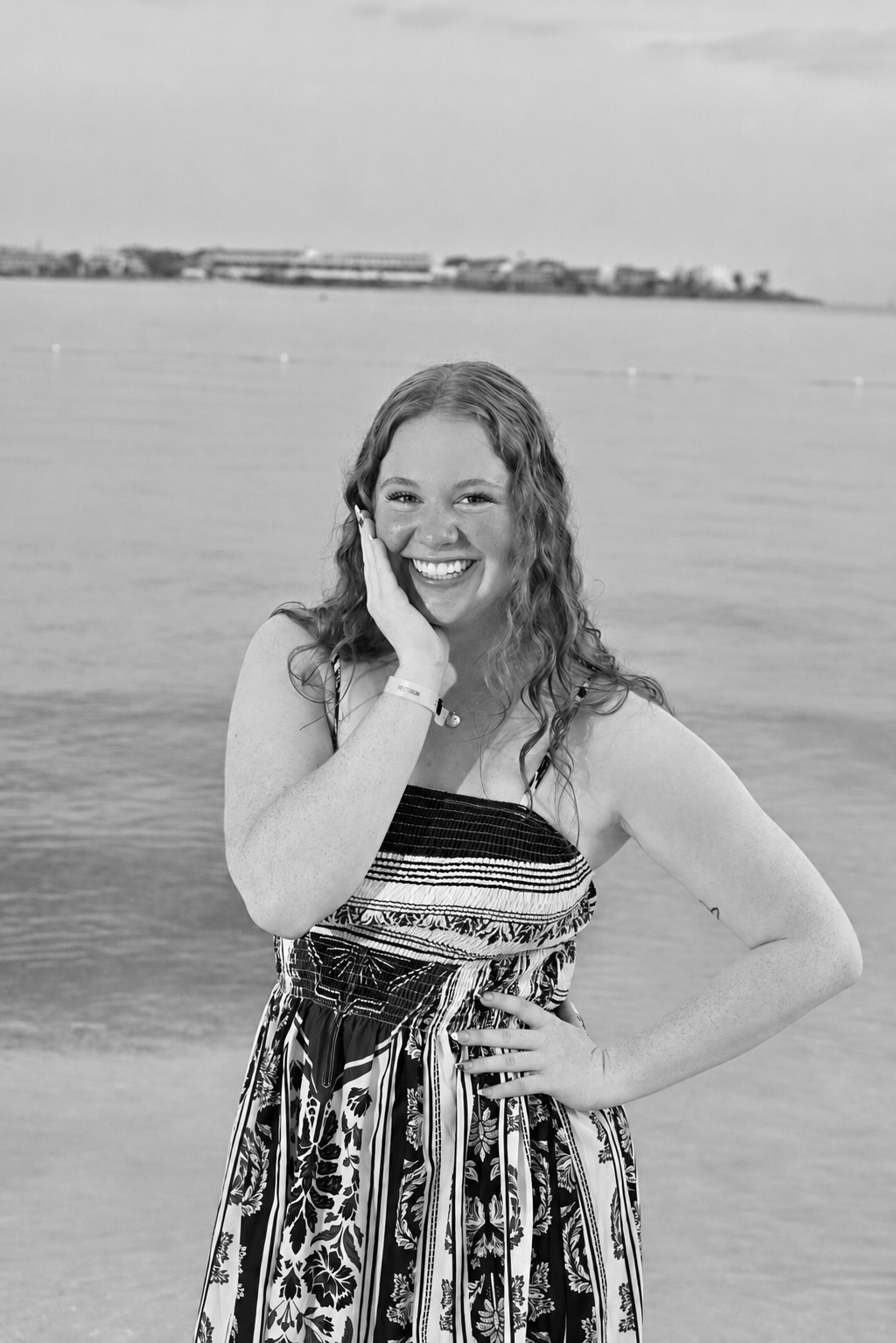 Portrait of Elizabeth smiling by the water